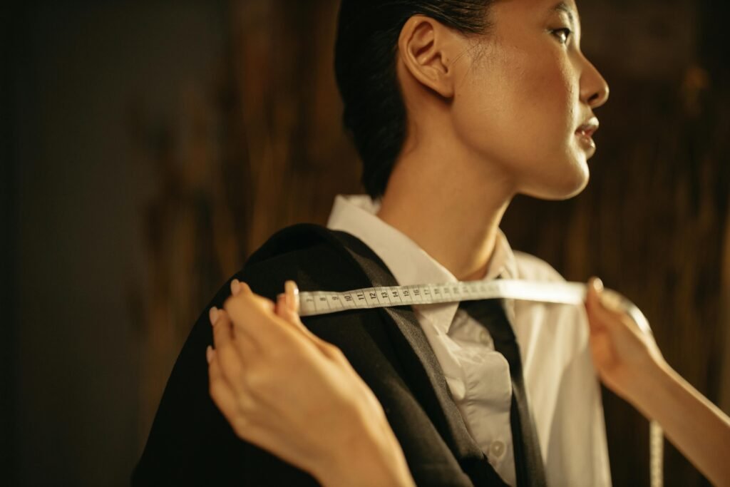 Tailor taking precise measurements for custom fit